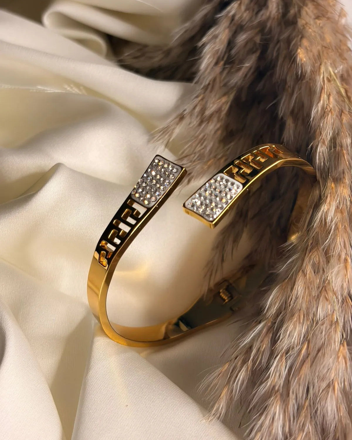 Anti tarnish bangle on a fur and satin background
