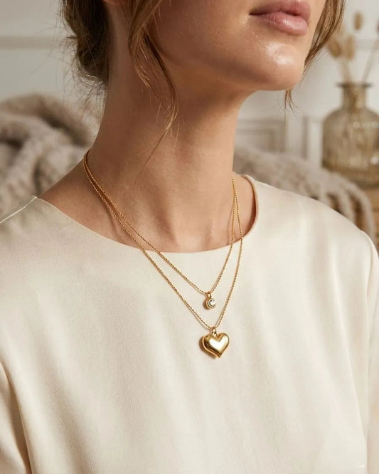 Double Layered Necklace With a Heart Pendant and a Stone